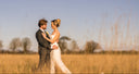 bride & groom in long grass